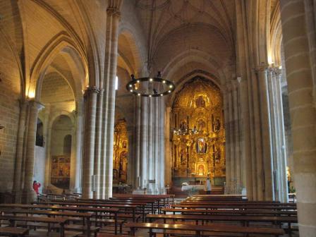 The medieval interior is dominated by a Baroque altarpiece that remained in place after the church was restored.
